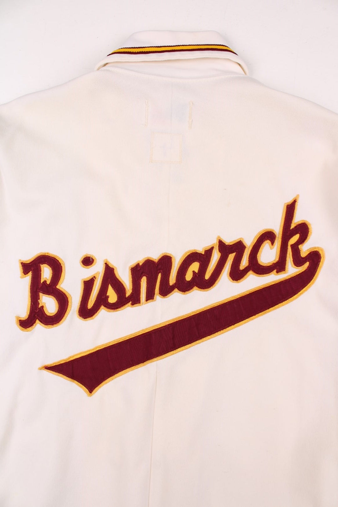 Vintage 60's Bismarck High School Demons shirt in white with burguny and yellow stripes, snap closure, and team logo embroidery front and back.