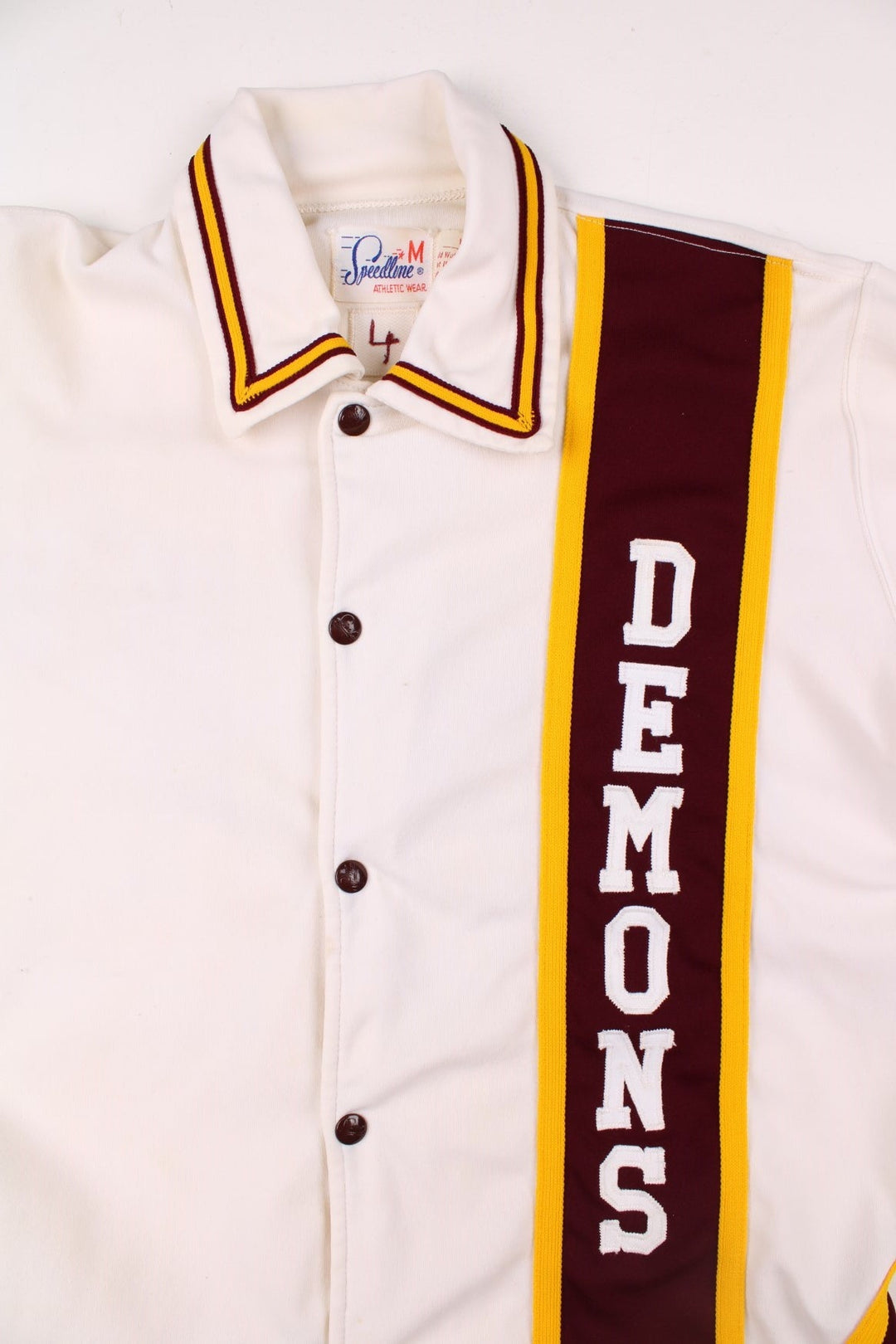 Vintage 60's Bismarck High School Demons shirt in white with burguny and yellow stripes, snap closure, and team logo embroidery front and back.