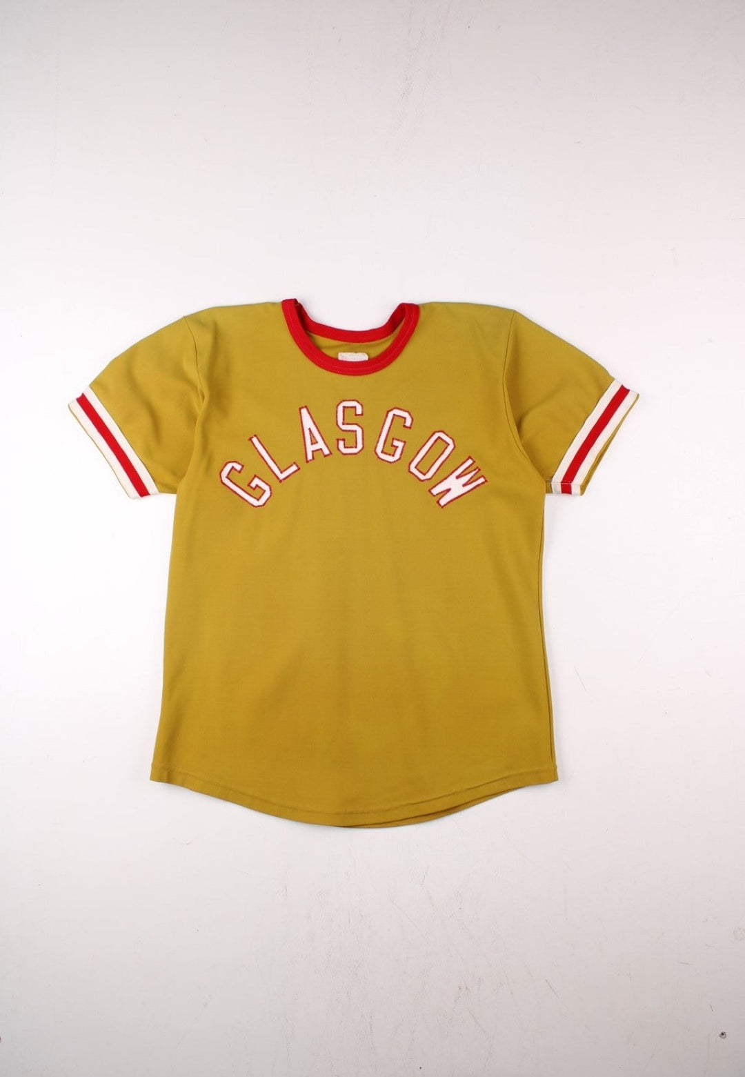 Vintage 60's Glasgow Sports Jersey in a gold yellow with red and white stripe detailing, 'Glasgow' embroidered on the front and number 29 on the back.