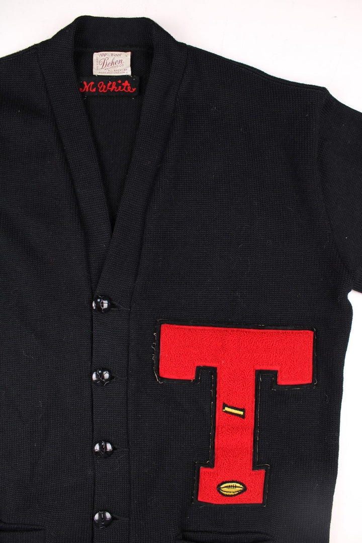 Vintage Dehen Wool Letterman Cardigan in black with button closure, two pockets, and red embroidery of a large letter T, number 74, and a tiger badge on the right sleeve.