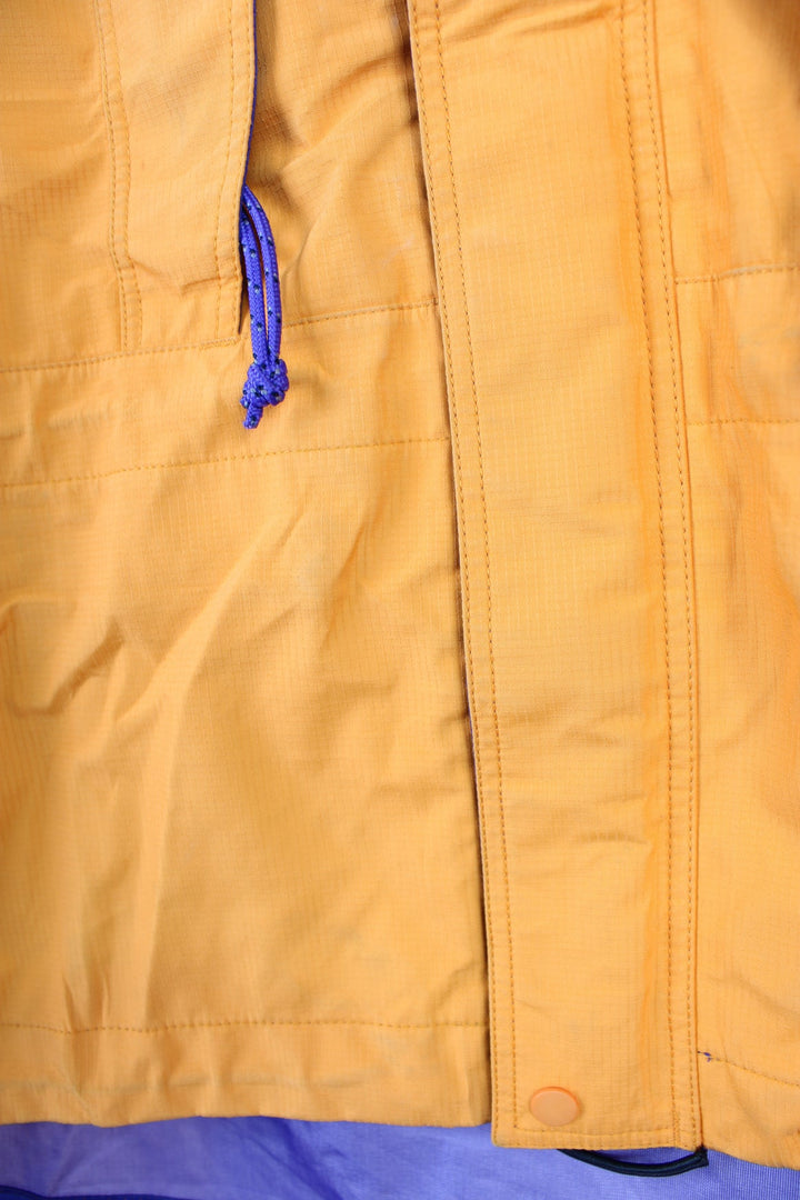 Orange and purple Patagonia hooded rain jacket with embroidered logo on the chest and multiple pockets.