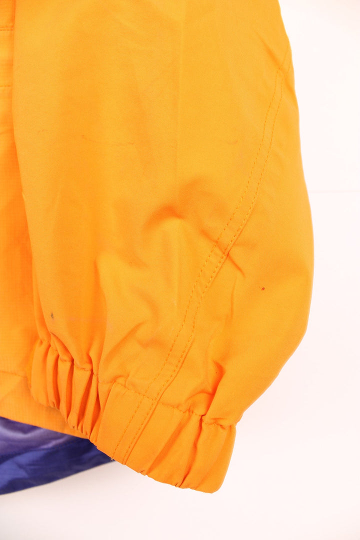 Orange and purple Patagonia hooded rain jacket with embroidered logo on the chest and multiple pockets.