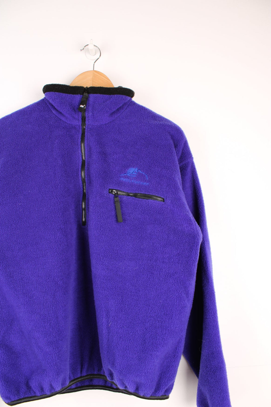 Vintage Helly Hansen pullover fleece with half zip, chest pocket and embroidered logo.