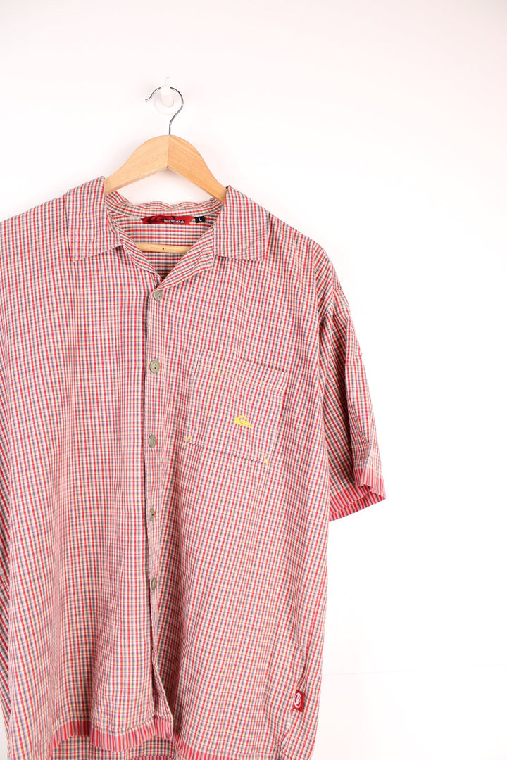 Quiksilver red checked shirt with chest pocket, embroidered logo on the front and printed logo across the back.