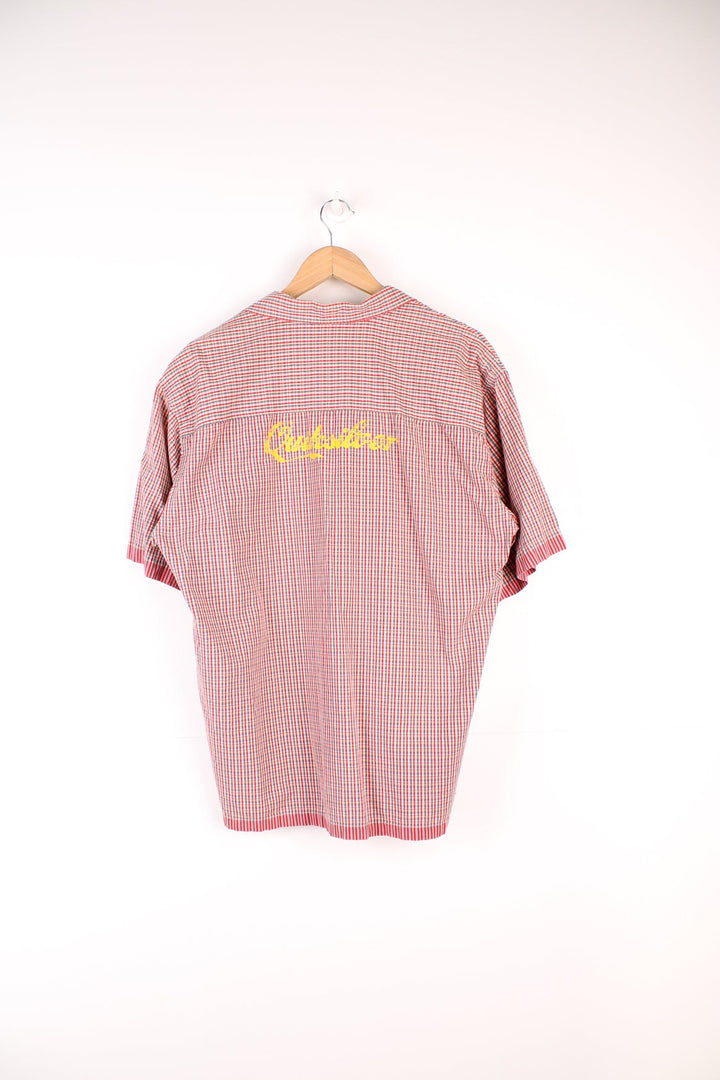 Quiksilver red checked shirt with chest pocket, embroidered logo on the front and printed logo across the back.