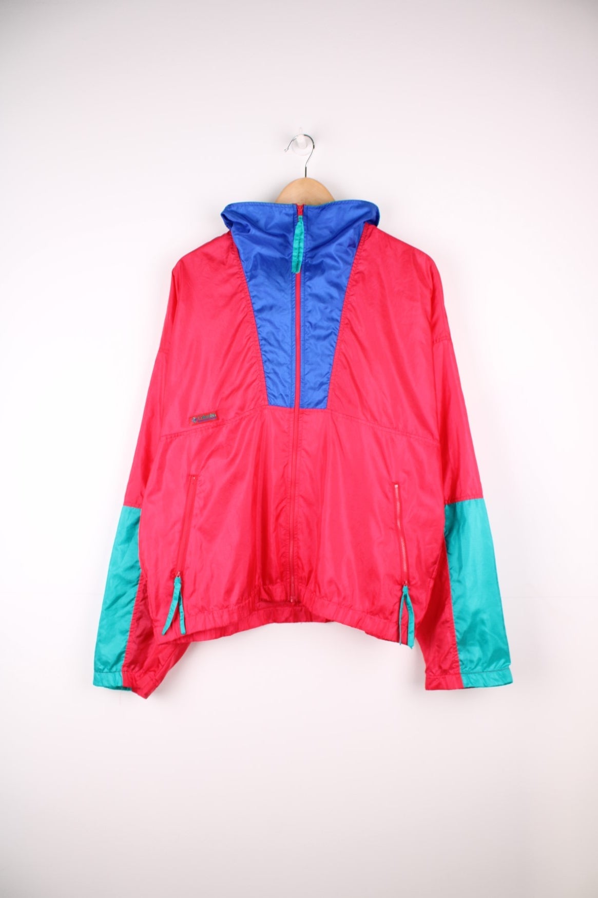 Vintage lightweight zip through Radial Sleeve windbreaker jacket by Columbia in red, blue and teal colour block Features logo on the above the right pocket.