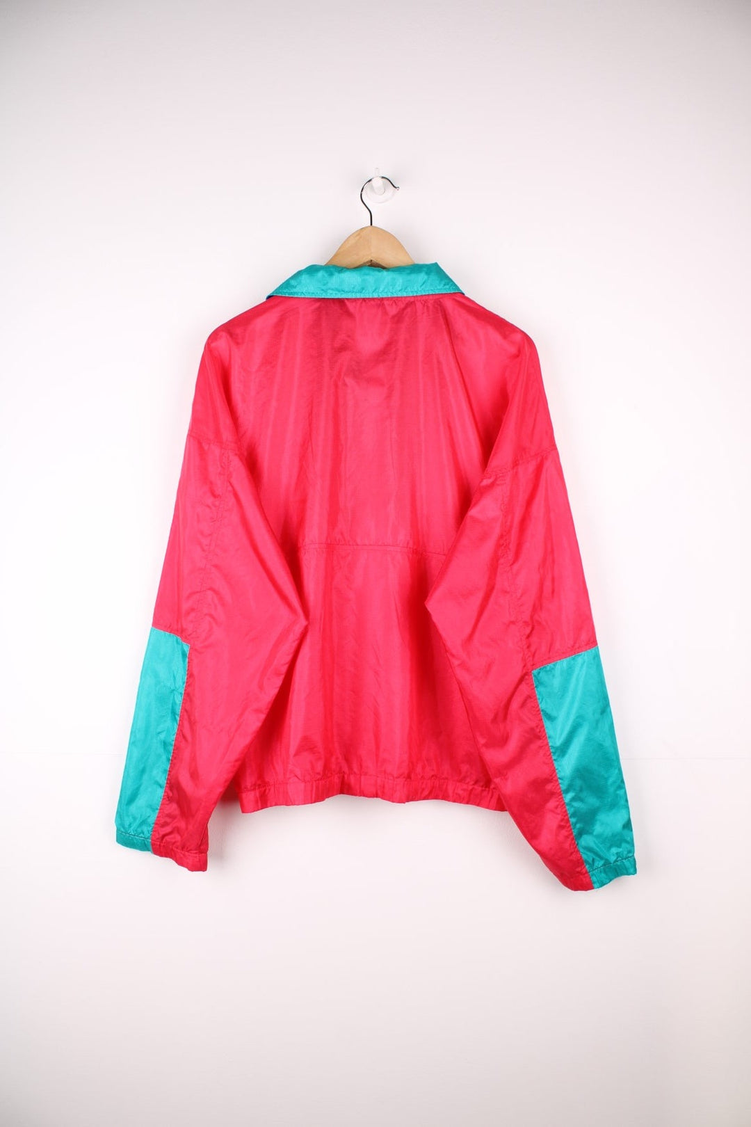 Vintage lightweight zip through Radial Sleeve windbreaker jacket by Columbia in red, blue and teal colour block Features logo on the above the right pocket.