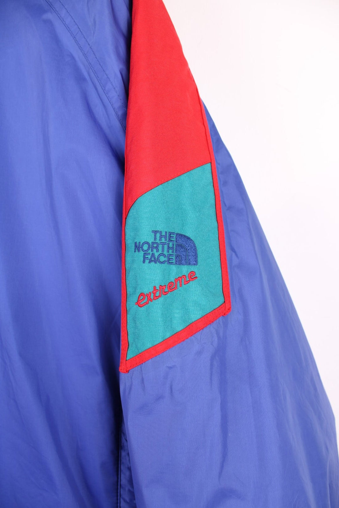 Vintage 1990's The North Face 'Extreme' padded Gore-Text jacket in a purple/blue colour way. Made in the USA . features embroidered logo on the shoulder