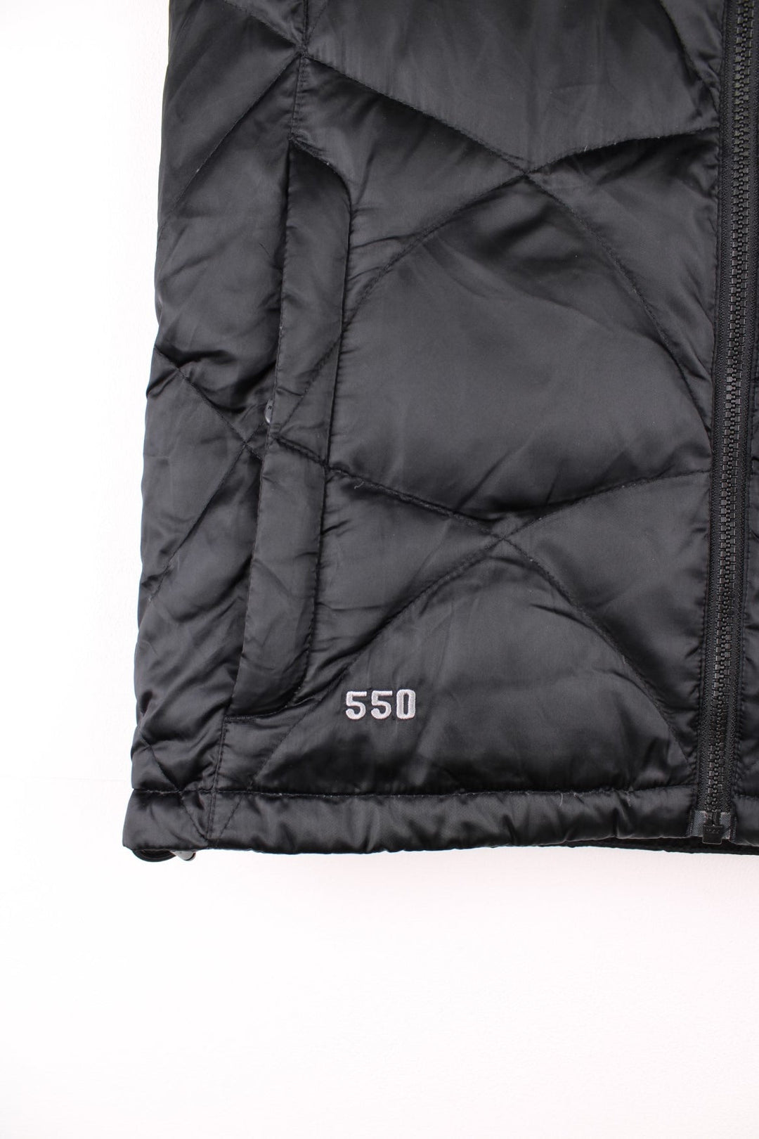 The North Face 550 all black double pocket satin gilet with embroidered logo on the front and back 