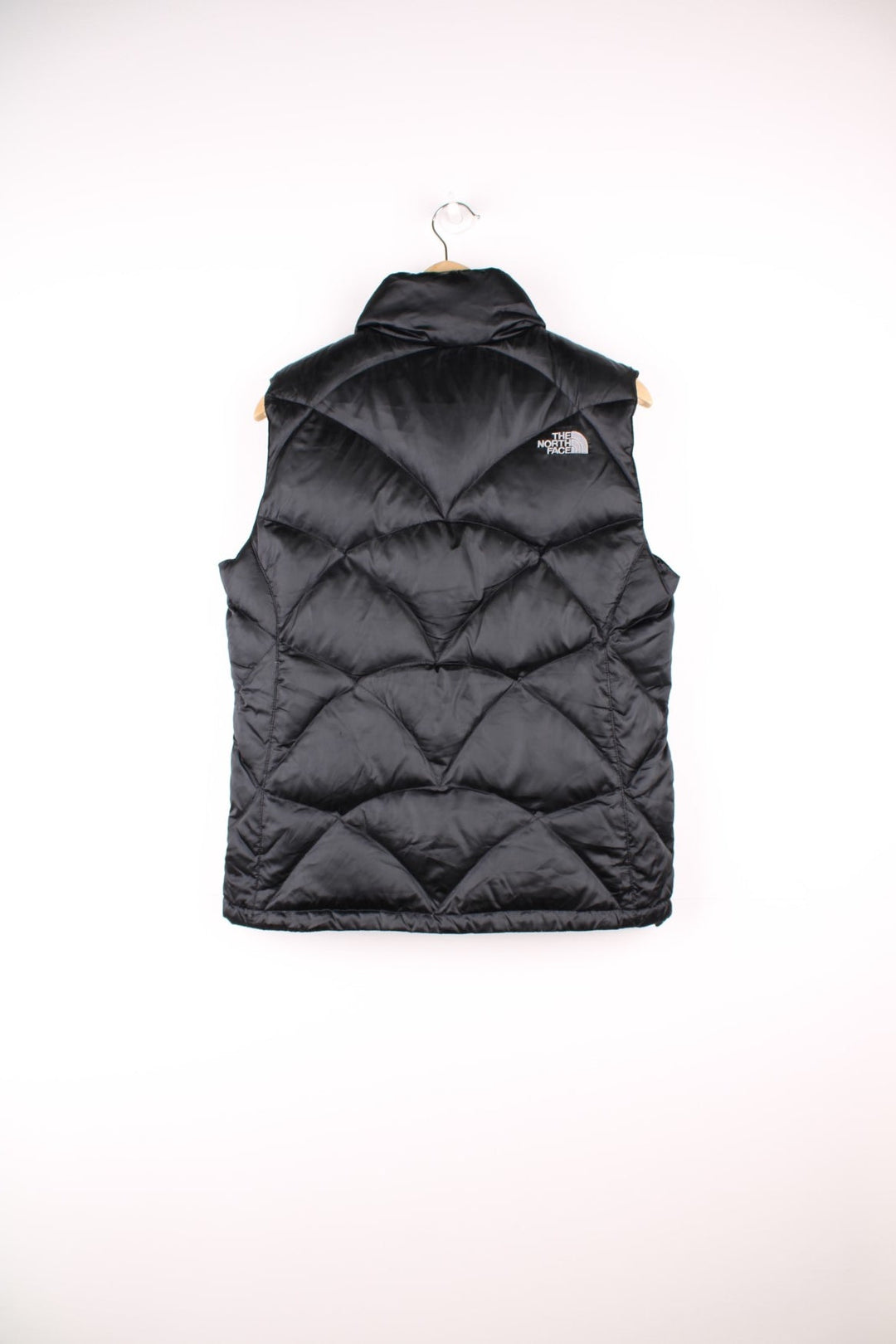 The North Face 550 all black double pocket satin gilet with embroidered logo on the front and back 