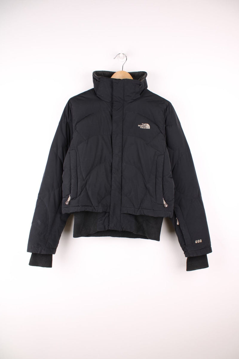 The North Face 600 black zip through bomber style puffer jacket with embroidered logos on the front and back