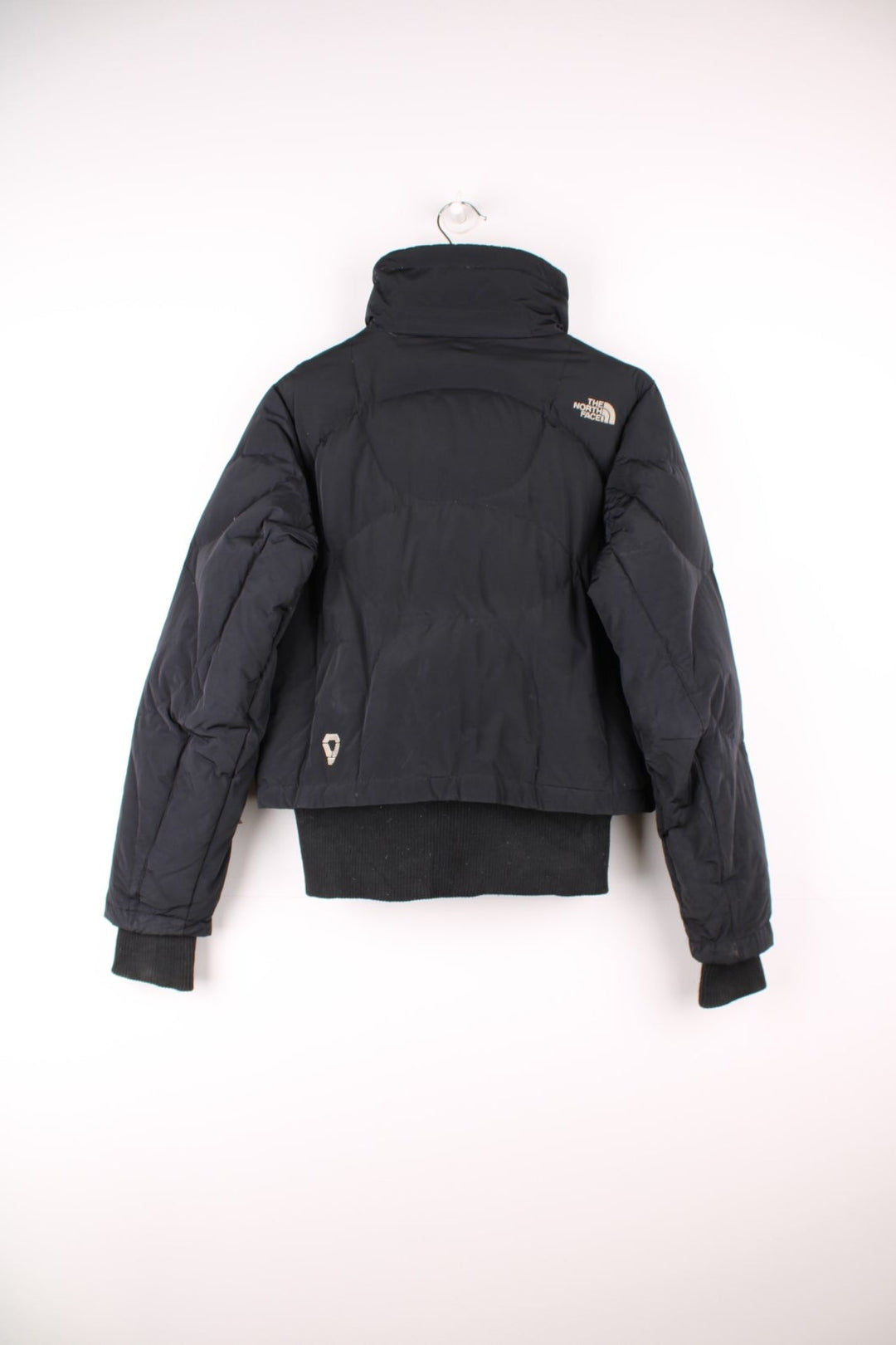 The North Face 600 black zip through bomber style puffer jacket with embroidered logos on the front and back