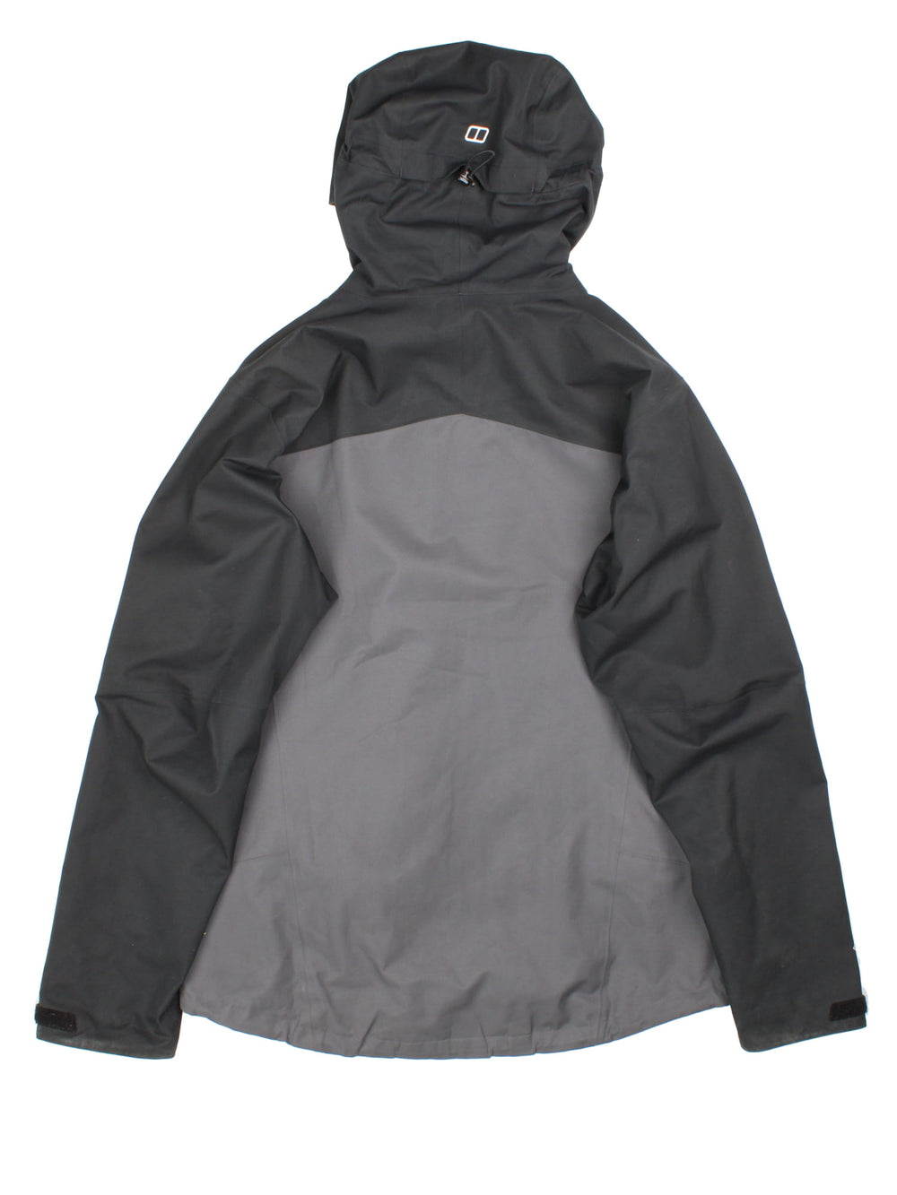 Berghaus Gortex Jacket in a black and grey colourway. Gortex waterproof shell with zip pockets and classic logo on the front.