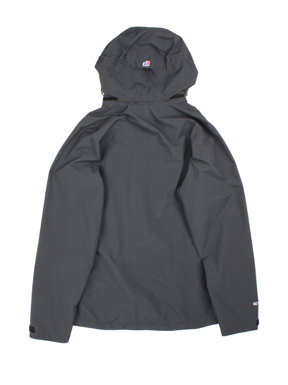 Berghaus Gortex Jacket in a black colourway. Zip double pocket on front with classic logo on chest and thin netted lining inside.