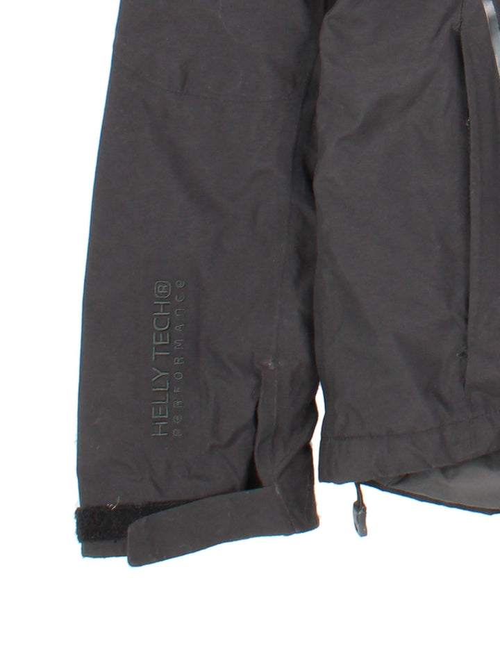 Helly Hansen Jacket in a black colourway. Full zip with multiple pockets and drawstring hood, Warmcore Primaloft technology, and has a small logo embroidered on front and down the left sleeve.