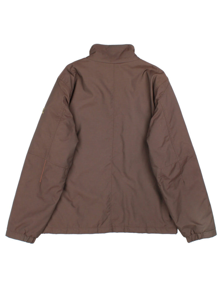 Helly Hansen Jacket in a brown colourway. Has multiple pockets, full zip closure and insulated with a quilted lining. Has the logo on the left sleeve.