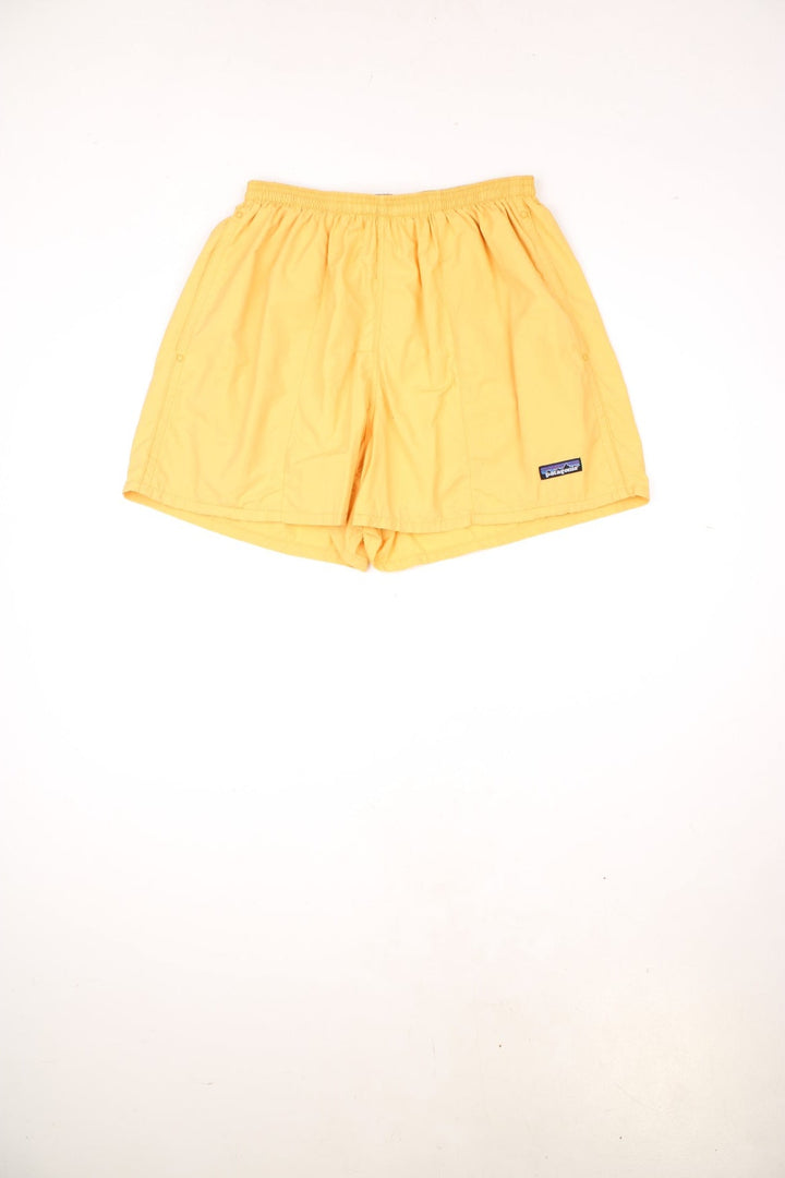 Vintage 90s Patagonia yellow swim shorts with elasticated, drawstring waist. Features embroidered logo.