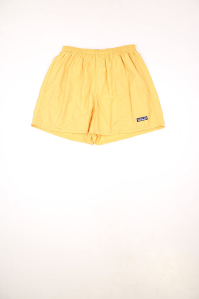 Vintage 90s Patagonia yellow swim shorts with elasticated, drawstring waist. Features embroidered logo.