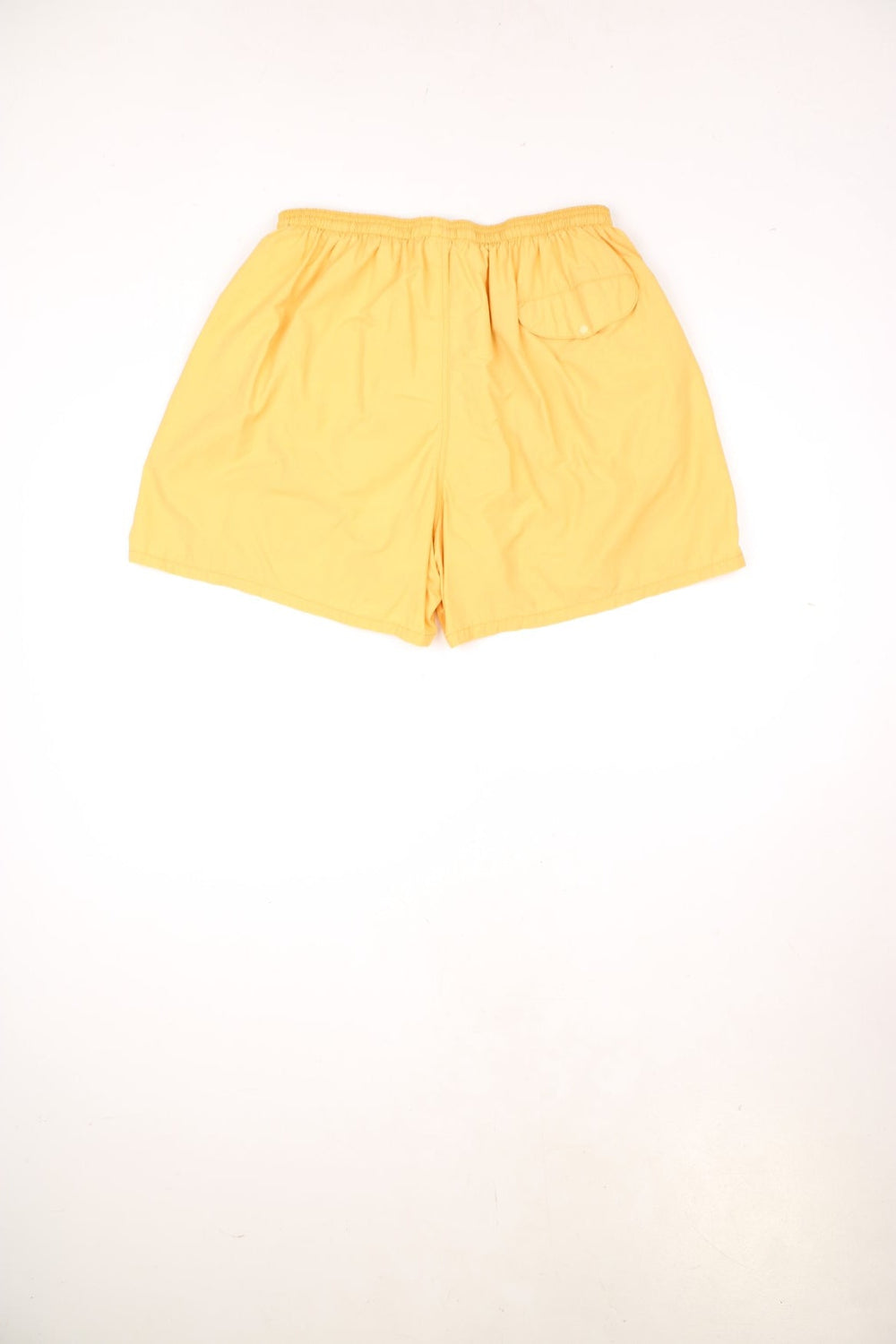 Vintage 90s Patagonia yellow swim shorts with elasticated, drawstring waist. Features embroidered logo.