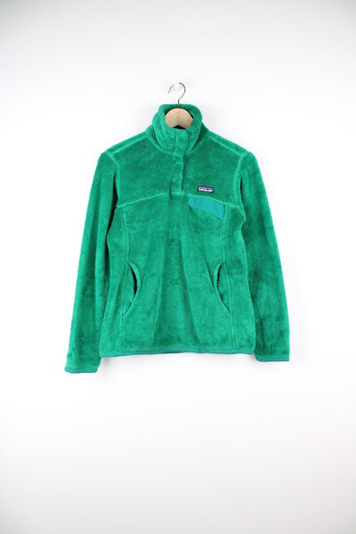 Patagonia Snap-T pullover Polartec fleece in green. Features chest pocket and embroidered logo.