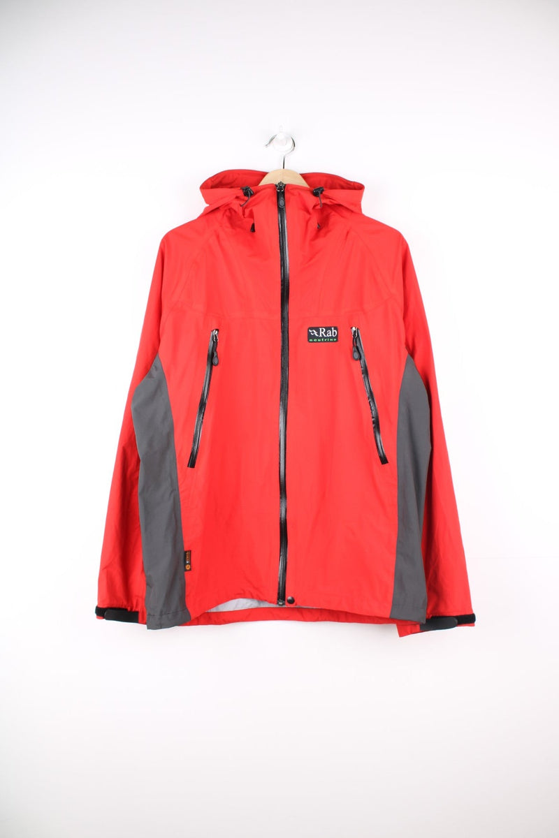 Vintage red and grey Rab neutrino hooded rain jacket. Features embroidered logo on the chest. 