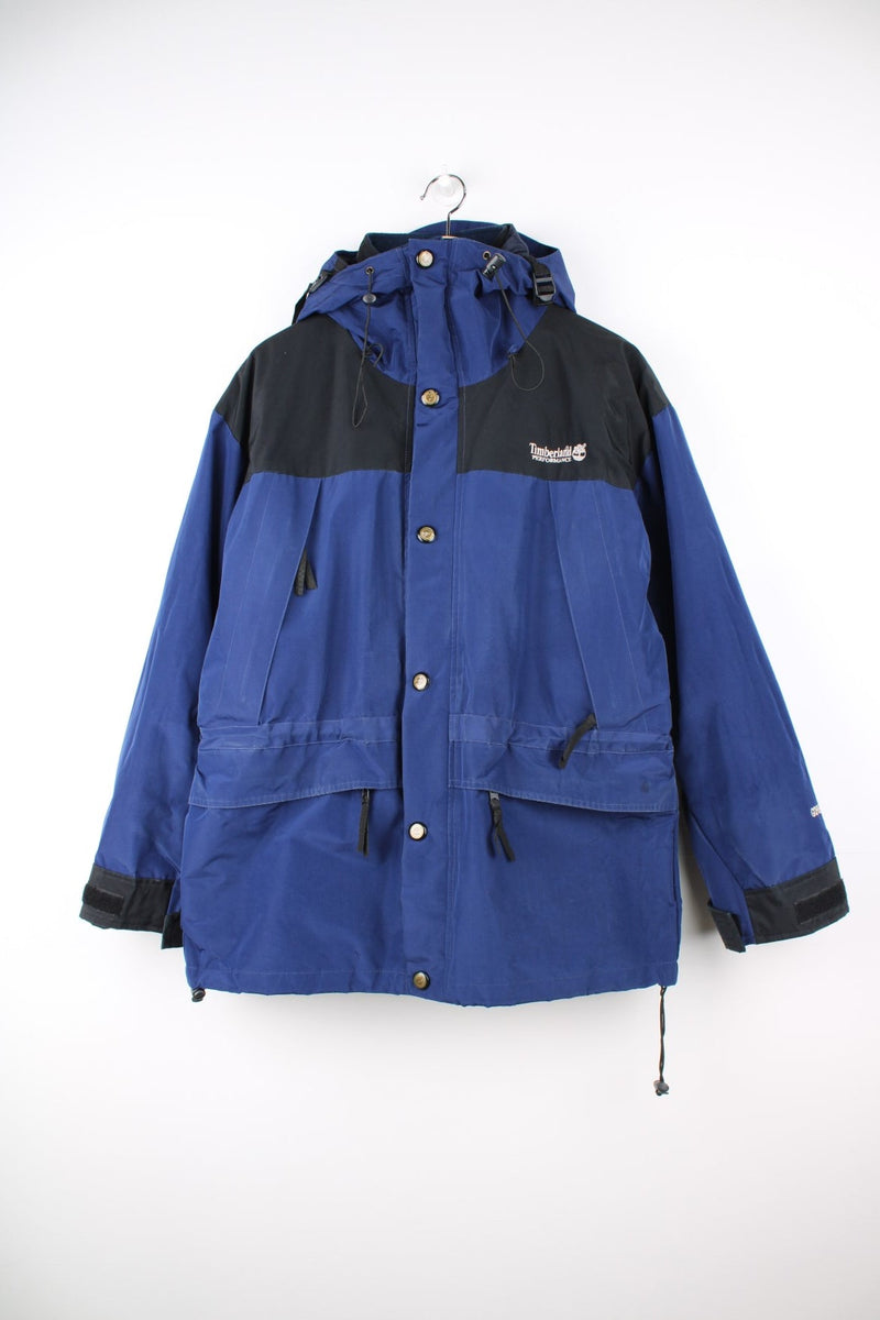 Vintage Timberland Performance Gore-Tex hooded jacket. Features removable fleece lining, embroidered logo on the chest and multiple pockets.