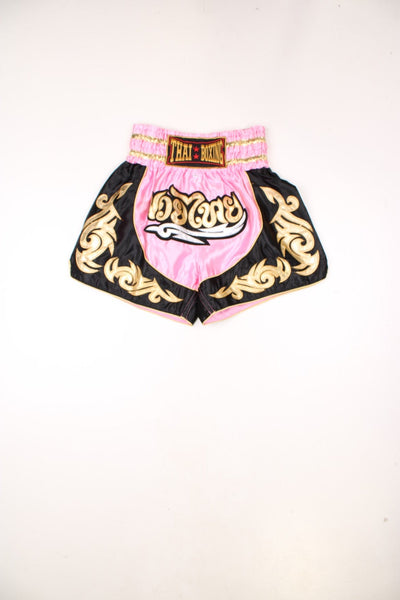 Thai boxing shorts in pink and black, with embroidered gold accents.