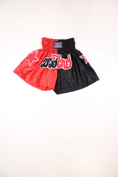 Duo Gear Thai boxing shorts in red and black with embroidered stars and lettering.