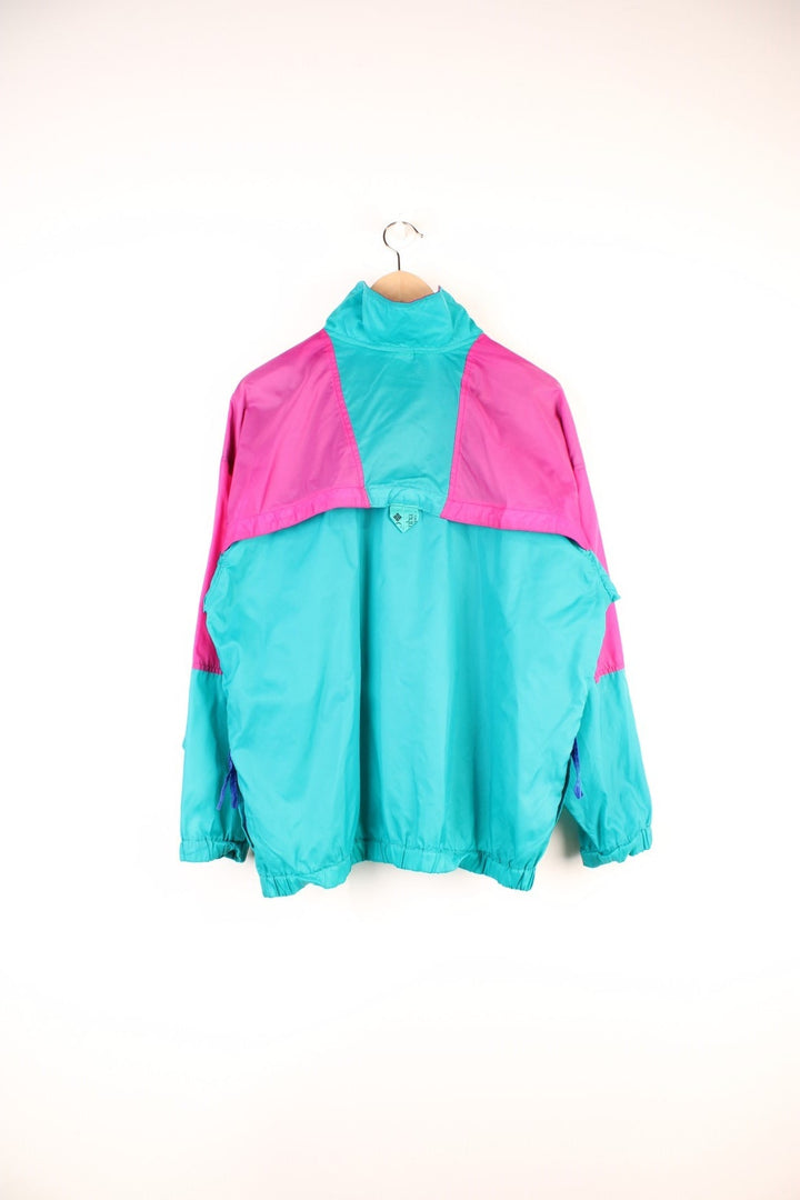 Columbia Lightweight Anorak Jacket in a pink and turquoise colourway, quarter zip up, pouch pockets, and has the logo embroidered on the front. 