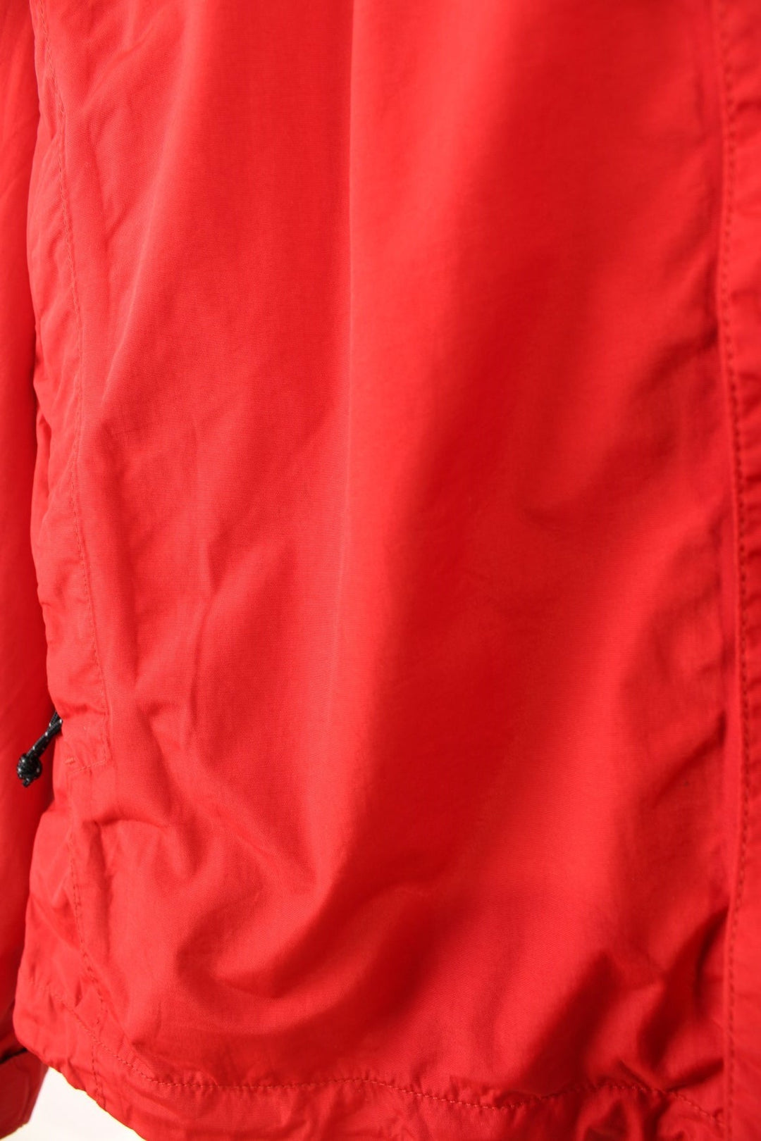 The North Face Hyvent Jacket in a red colourway, zip up with side pockets, hooded, and has the logo embroidered on the front and back. 