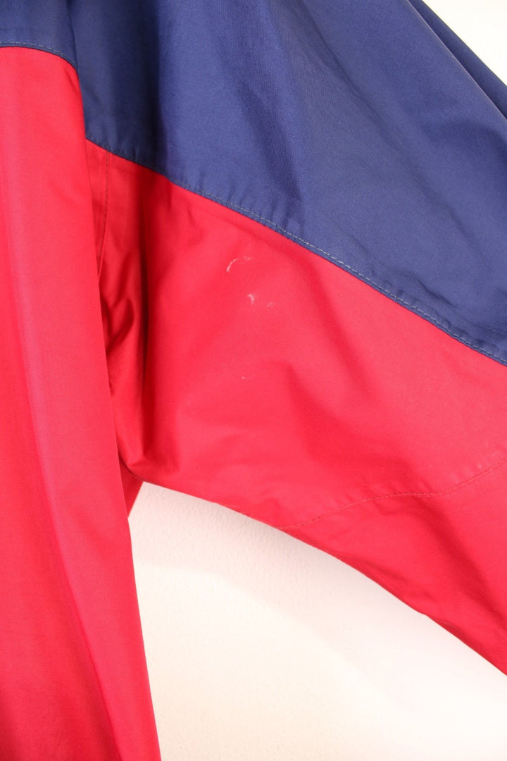 Vintage 90's Berghaus Mountain Trek Jacket in a red and blue colourway, zip up with side pockets, has a mesh lining, hooded and has the logo embroiderd on the front.