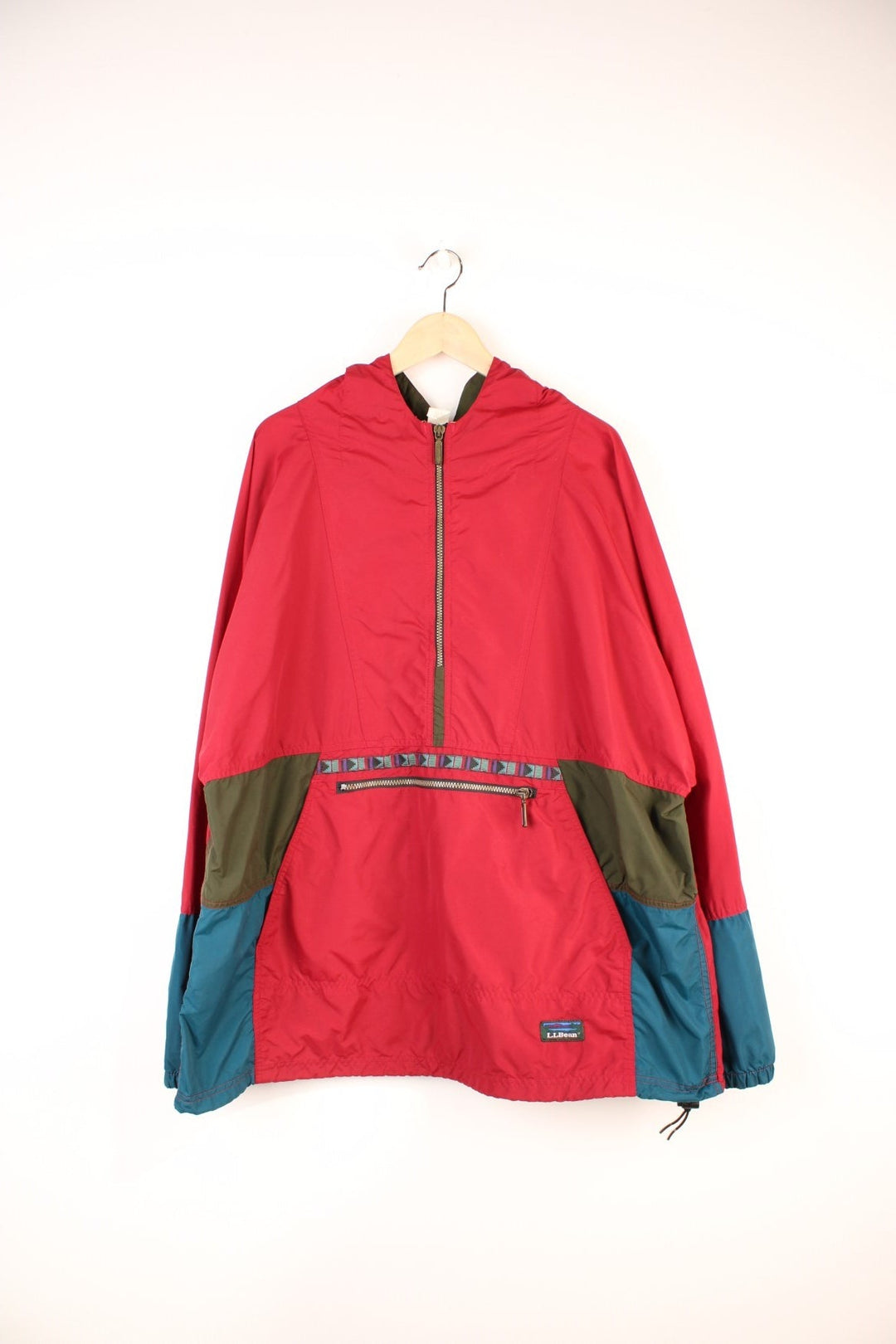 L.L. Bean Aztec Anorak Jacket in a red and green colourway, half zip up with pouch pockets, hooded and has the logo embroidered on the front. 