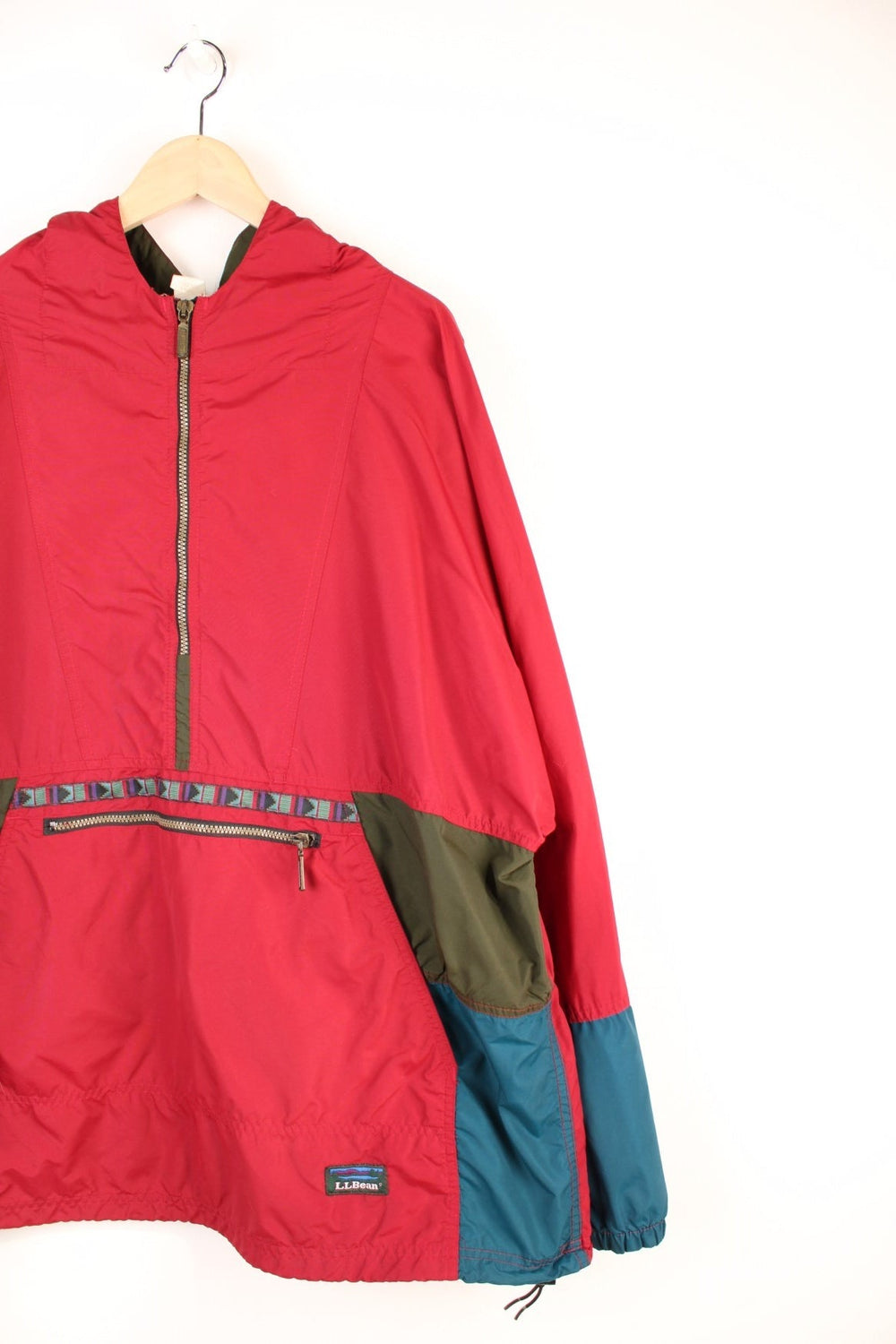 L.L. Bean Aztec Anorak Jacket in a red and green colourway, half zip up with pouch pockets, hooded and has the logo embroidered on the front. 