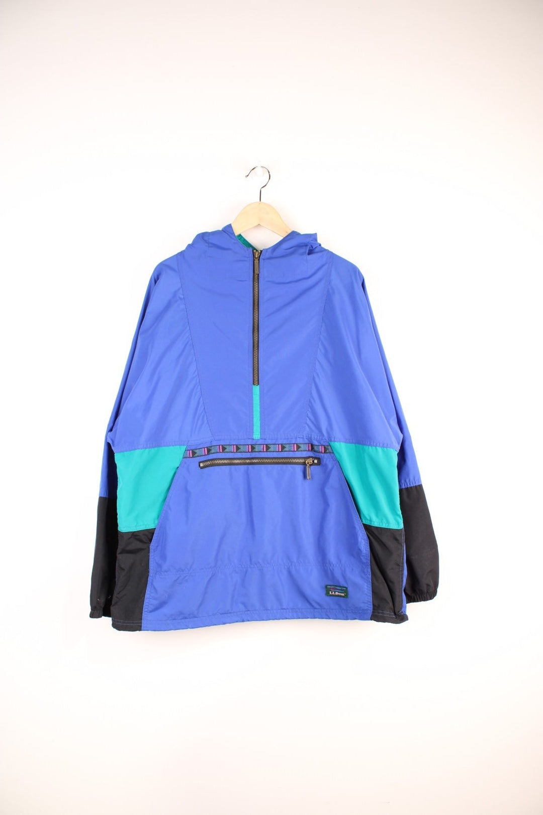 L.L. Bean Aztec Anorak Jacket in a blue and black colourway, half zip up with pouch pockets, hooded and has the logo embroidered on the front. 