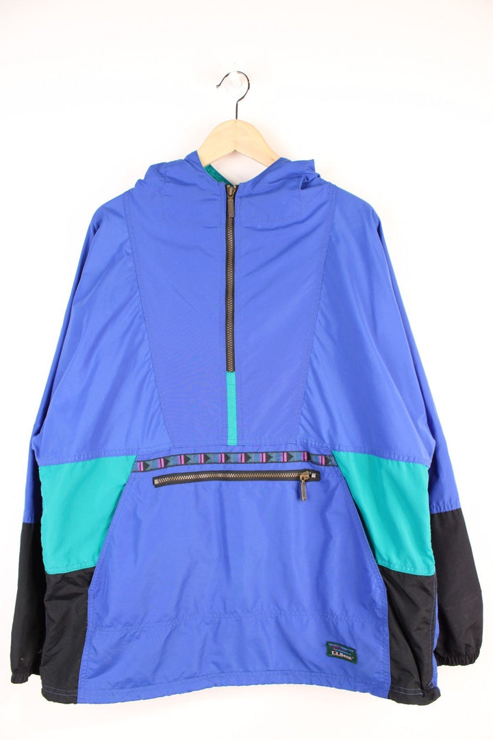 L.L. Bean Aztec Anorak Jacket in a blue and black colourway, half zip up with pouch pockets, hooded and has the logo embroidered on the front. 