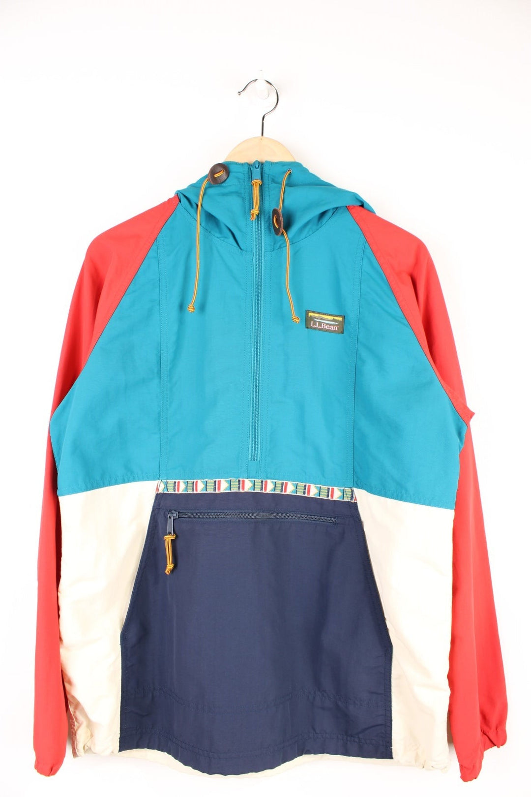 L.L. Bean Mountain Classic Anorak Jacket in a blue, red and white colourway, half zip up with pouch pockets, has an aztec pattern going across the front, hooded and has the logo embroidered on the chest. 