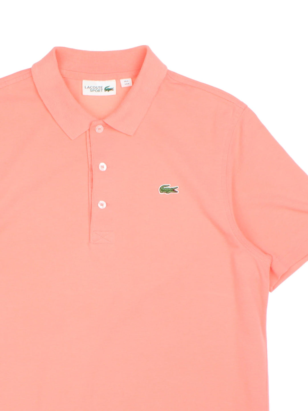 Vintage Lacoste Polo Shirt in a coral pink colourway with, logo embroidered on the front.