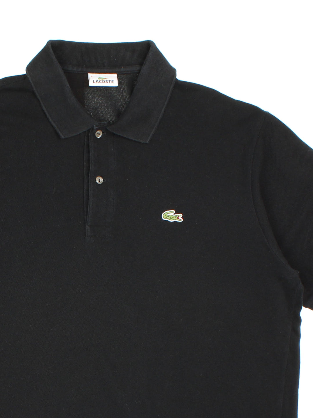 Vintage Lacoste Polo Shirt in a black colourway and has the logo embroidered on the front.