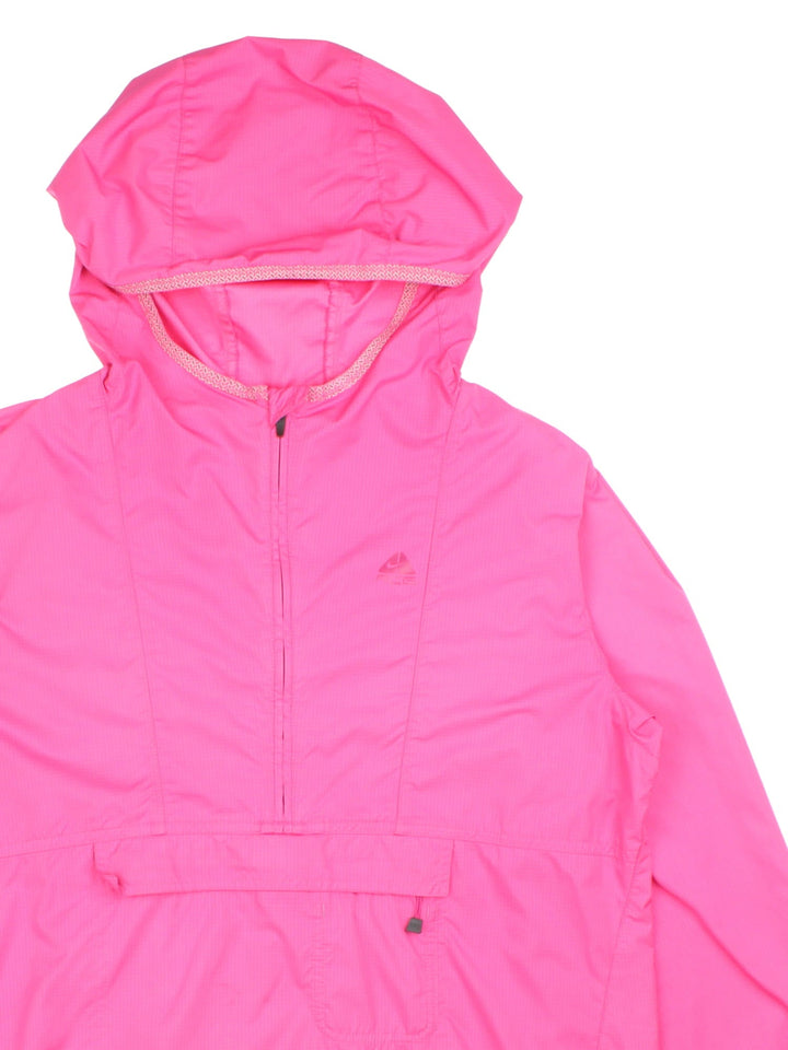 Vintage Nike ACG Windbreaker in a pink colourway, 1/4 zip fastening with hood and packs into mesh storage bag.