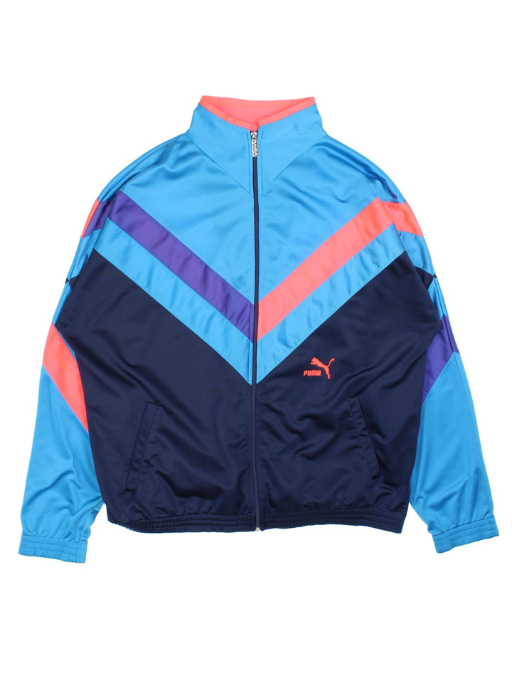 Vintage 80's Puma tracksuit top in a blue colourway, zip fastening and embroideded logo on front and back.