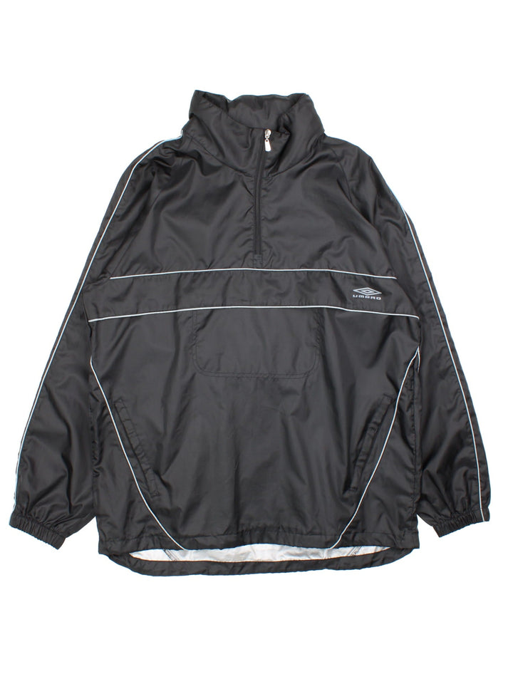 Vintage Umbro windbreaker in a black colourway, 1/4 zip fastening and has the logo printed on the front and back.