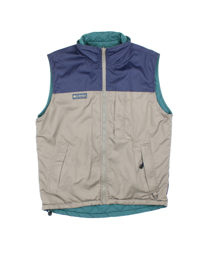 Vintage Reversible Columbia Gilet in either a blue and beige, or green colourway options, multiple pockets with quilted reverse and patch branding on front.