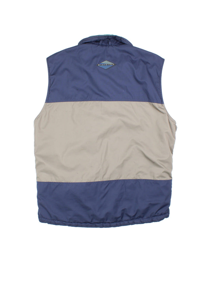 Vintage Reversible Columbia Gilet in either a blue and beige, or green colourway options, multiple pockets with quilted reverse and patch branding on front.