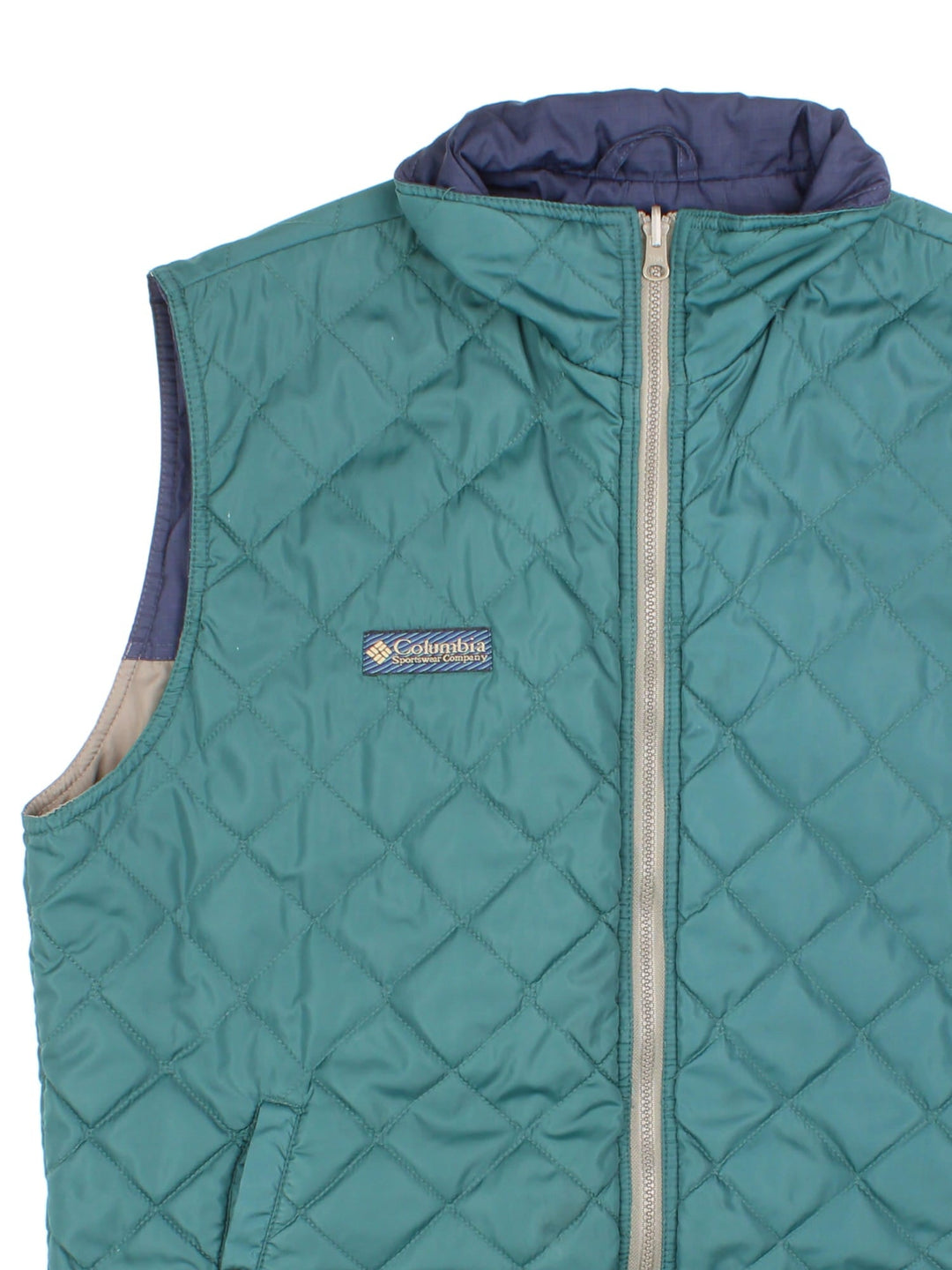 Vintage Reversible Columbia Gilet in either a blue and beige, or green colourway options, multiple pockets with quilted reverse and patch branding on front.