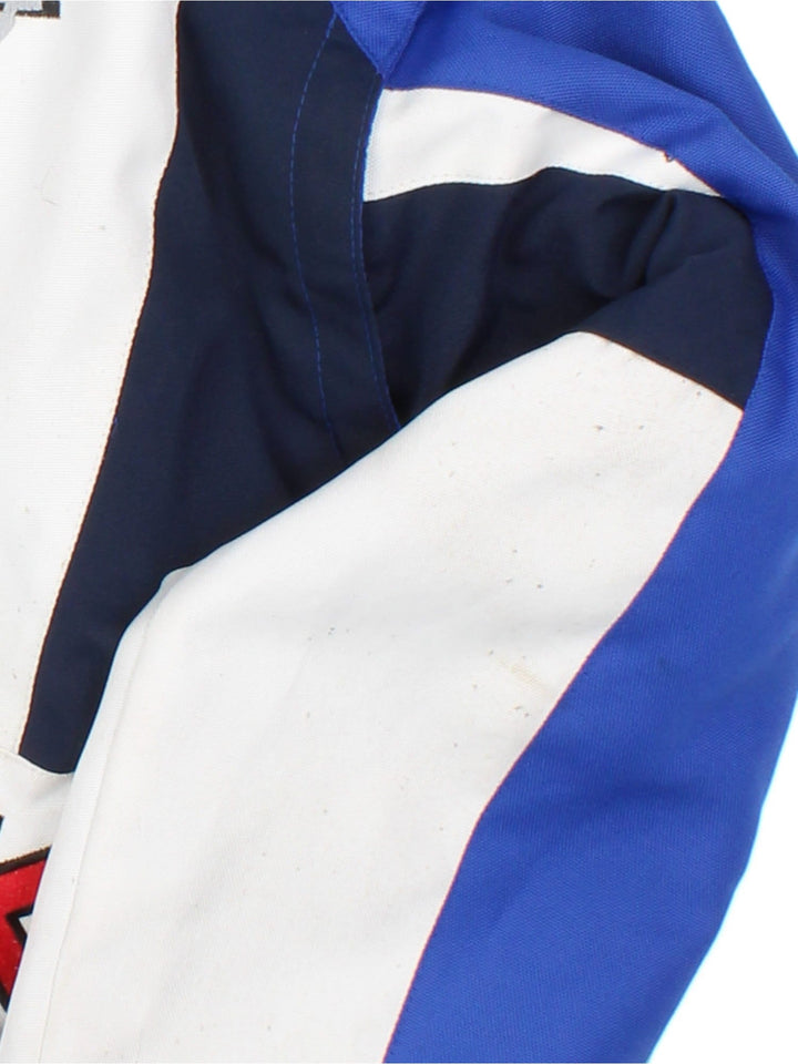 Vintage Suzuki Nascar Jacket in blue colourway, zip popper fastening and embroidered branding on front and back.