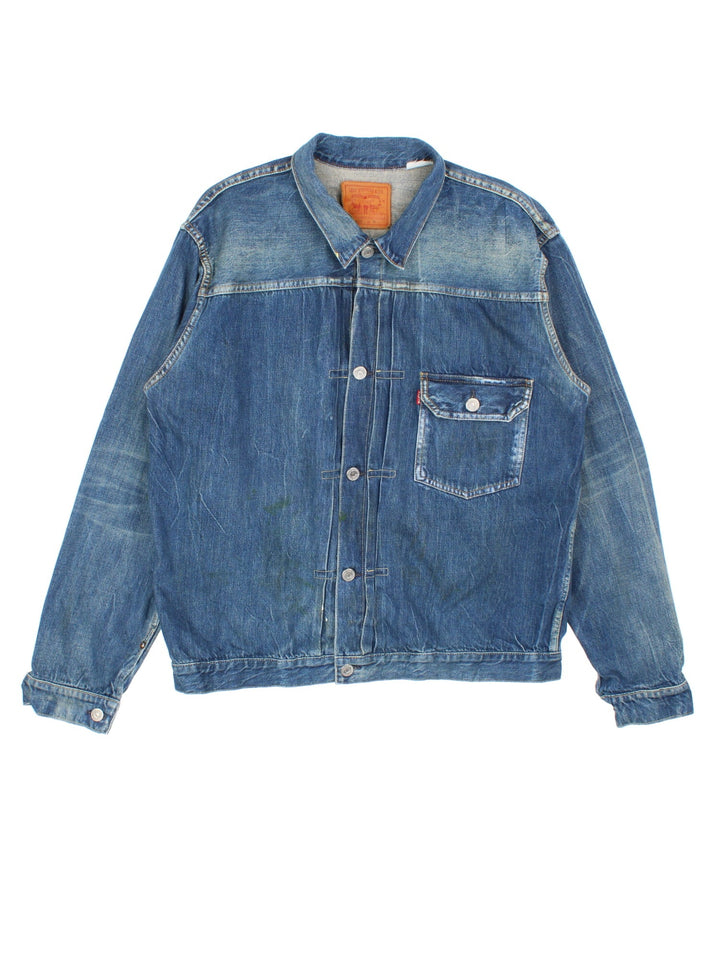 Vintage Levi Strauss Type 1 Denim Jacket in a blue colourway, button up fastening and classic red tab branding on front chest pocket, and has a back buckle.