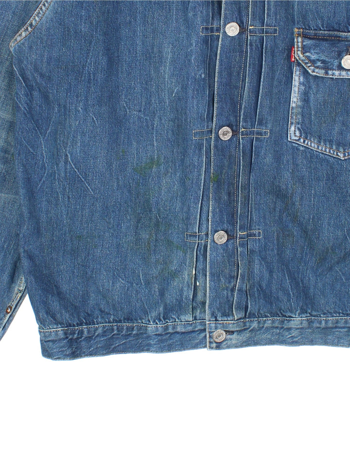 Vintage Levi Strauss Type 1 Denim Jacket in a blue colourway, button up fastening and classic red tab branding on front chest pocket, and has a back buckle.