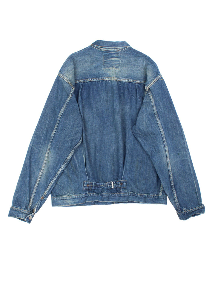 Vintage Levi Strauss Type 1 Denim Jacket in a blue colourway, button up fastening and classic red tab branding on front chest pocket, and has a back buckle.