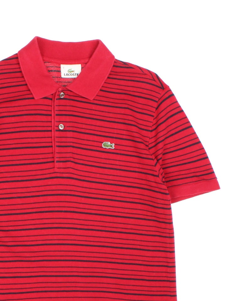 Vintage Lacoste Polo Shirt in a red and black striped colourway with the logo embroidered on the front.