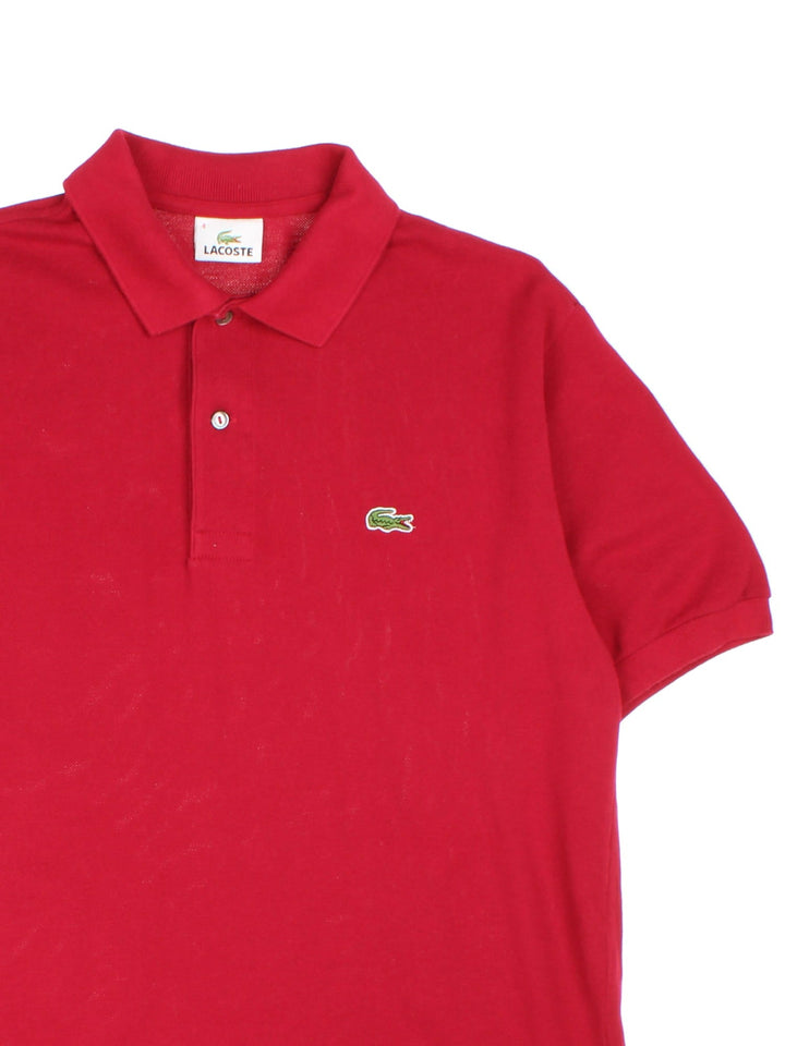 Vintage Lacoste Polo Shirt in a red colourway with the logo embroidered on the front.